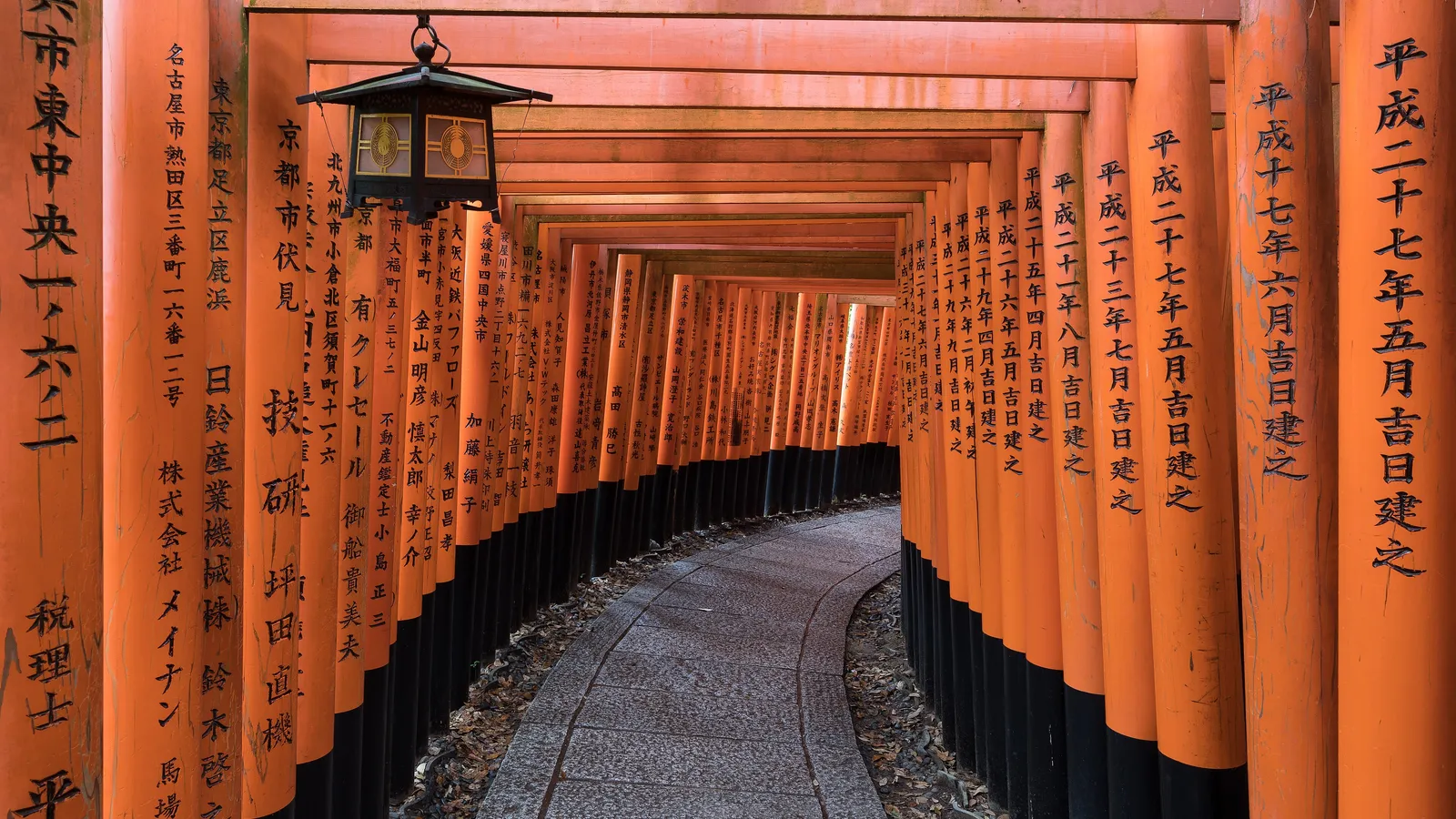 Kyoto street lined with traditional wooden buildings