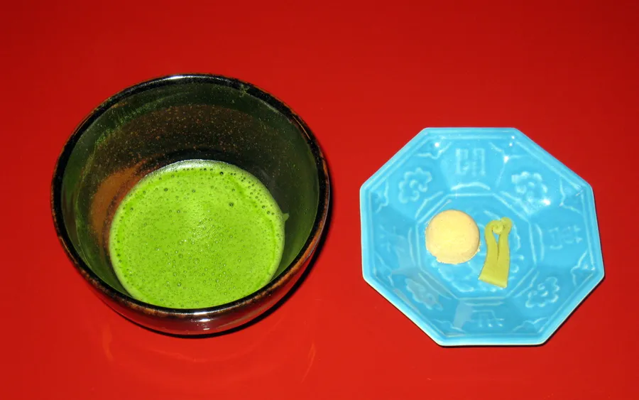 A bowl of matcha served with wagashi sweets