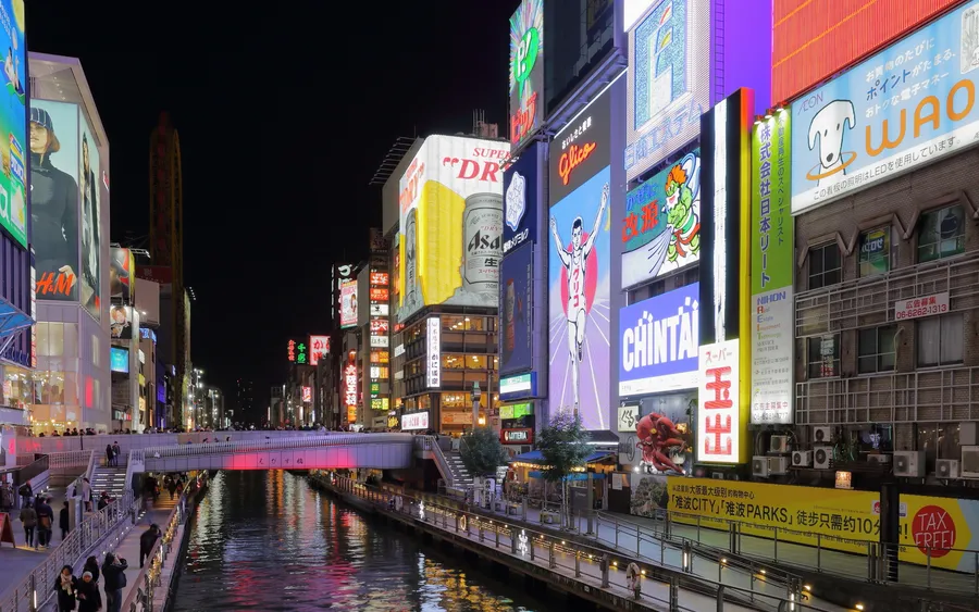 Dotonbori canal lit up with neon signs at night