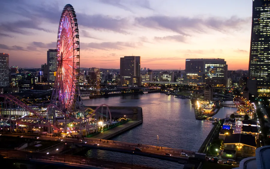 Tempozan Ferris Wheel lit up over Osaka Bay at dusk