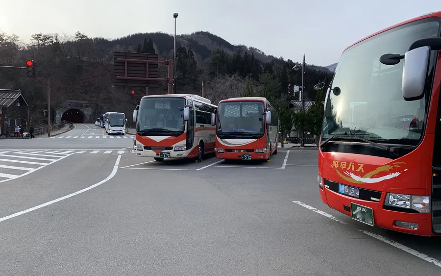 Highway buses parked at a mountain terminal in Shirakawa-go