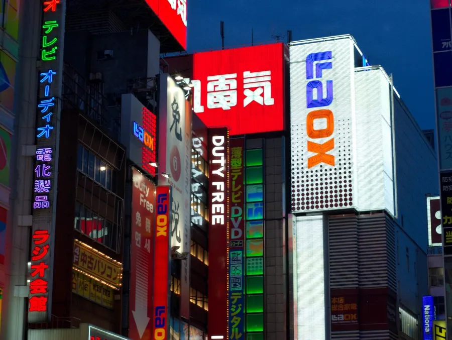 Neon-lit Akihabara electronics district at night