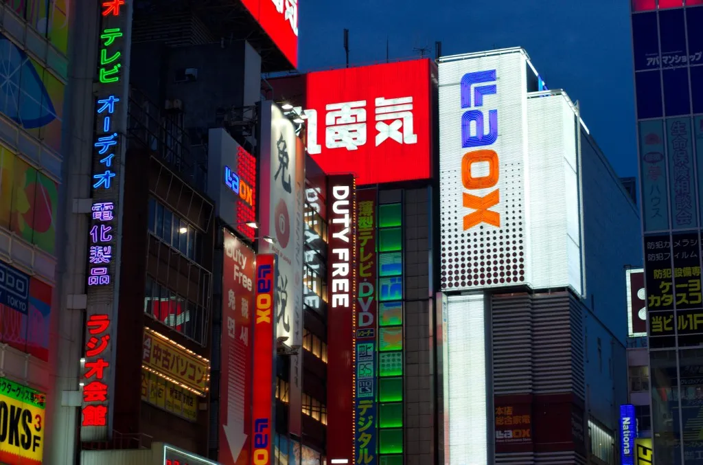 Neon-lit Akihabara electronics district at night
