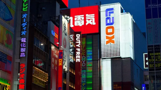 Neon-lit electronics signage in Akihabara, Tokyo, at night